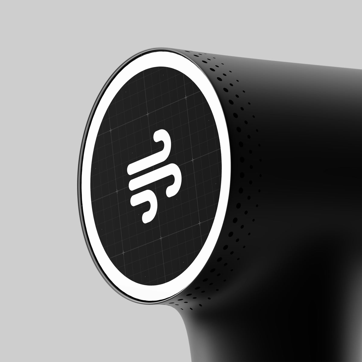 Close-up of a percussion massage gun, a recovery and mobility tool